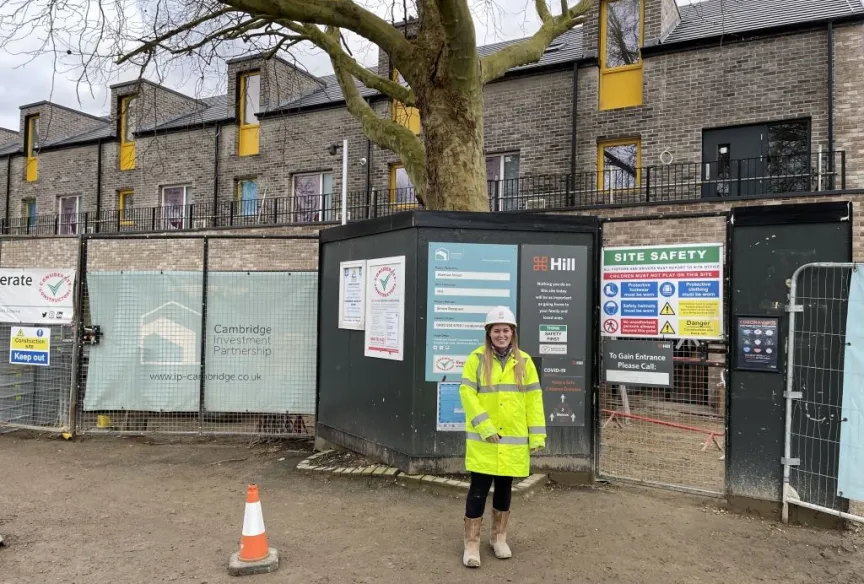 Woman standing infront of a construction site