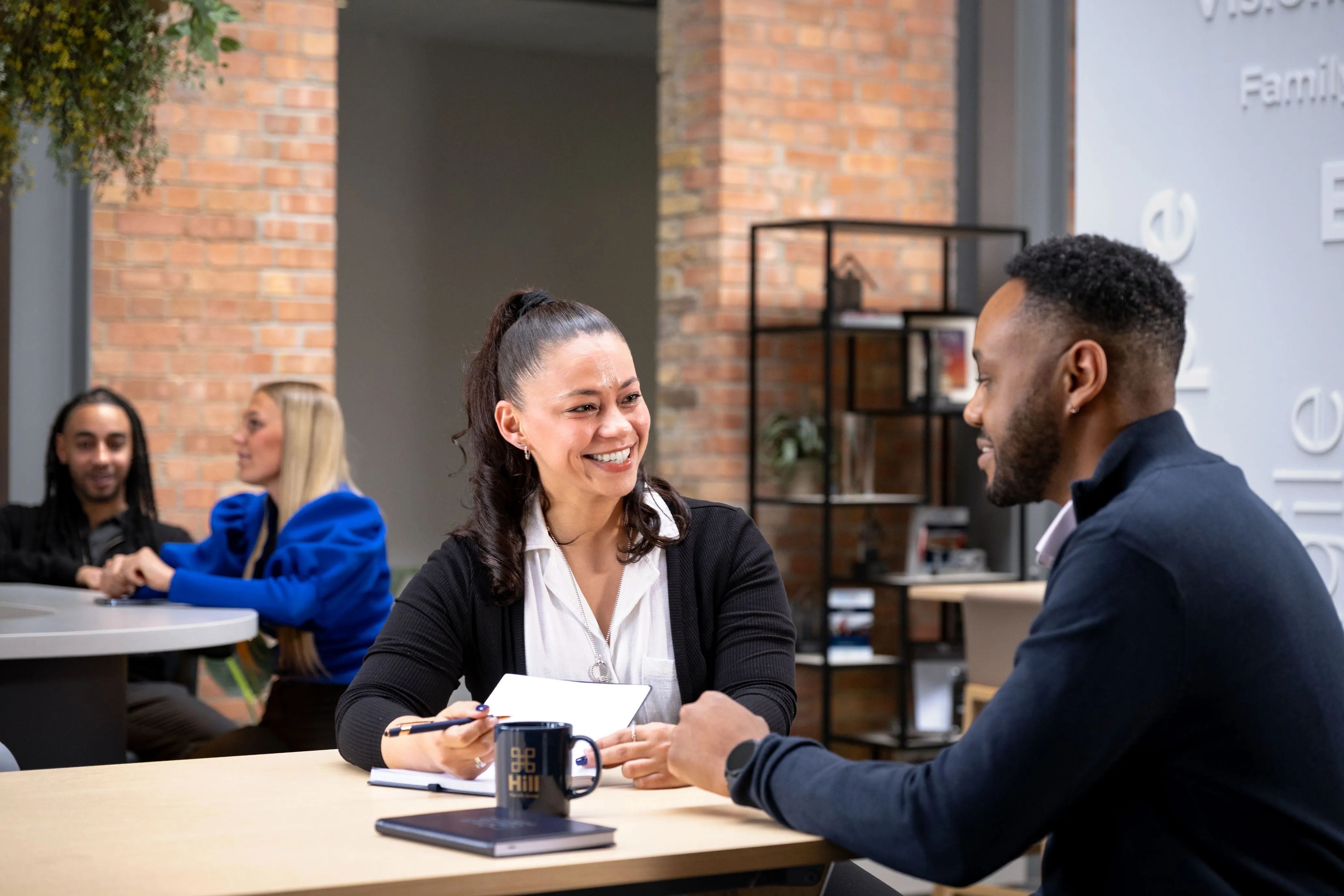 team hill sitting at a desk